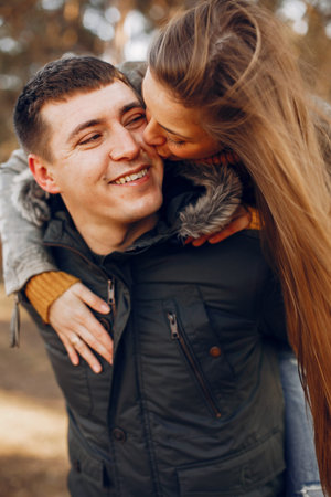 Beautiful couple spend time in a summer park