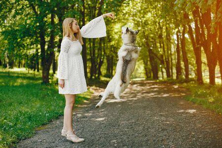 elegant girl with cute dogの写真素材