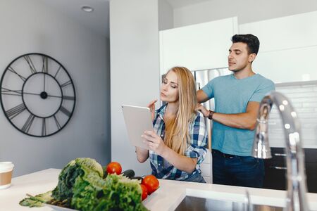 couple at home in a kitchenの写真素材