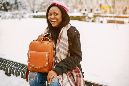 Elegant black girl in a winter city
