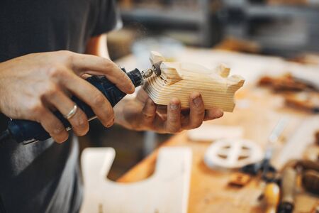 The carpenter works with a treeの写真素材
