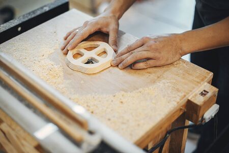 The carpenter works with a treeの写真素材