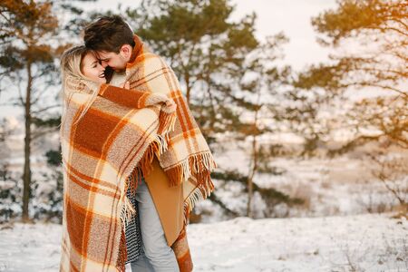 happy couple walking through the parkの写真素材