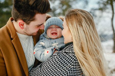 happy family of three in the parkの写真素材
