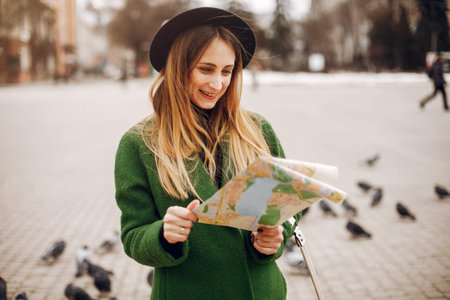 Beautiful woman walking in a spring parkの写真素材