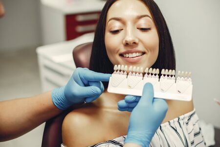 Beautiful girl in a dentistの写真素材