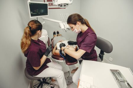 Beautiful girl in a dentistの写真素材