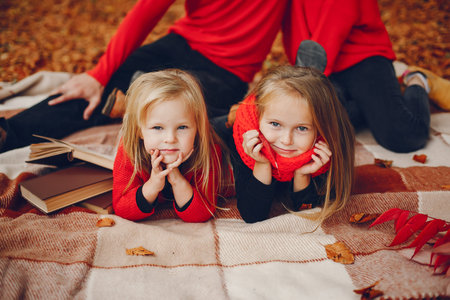 Family with cute kids in a autumn park