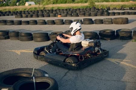 Karting. Man in a white t-shirt. Male with a kart carの写真素材