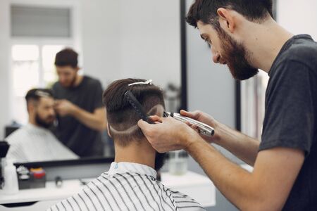 Man with a beard. Hairdresser with a client.の写真素材