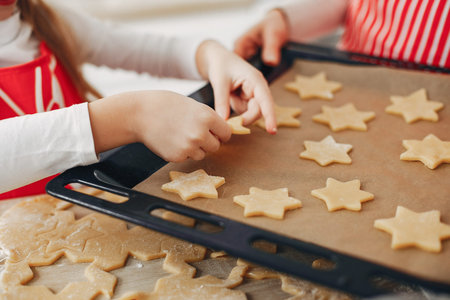Family cook the dough for cookies