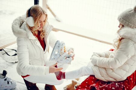 Cute and beautiful family in a winter cityの写真素材