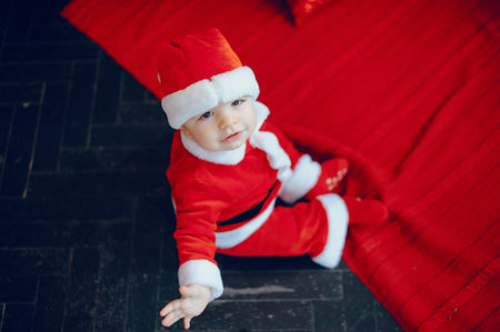 Cutte little boy at home near christmas decorations