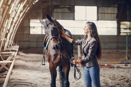 Beautiful woman spend time with a horseの写真素材