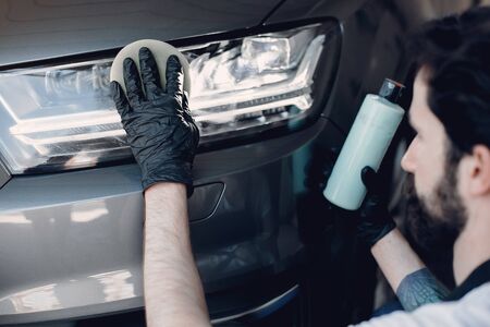Man polish a car in a garageの写真素材
