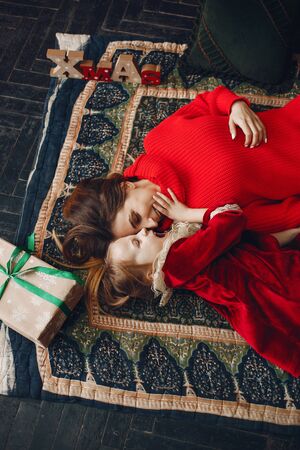 Mother with cute daughter at homeの写真素材