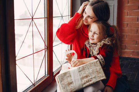 Mother with cute daughter at homeの写真素材