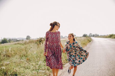 Cute and stylish family in a summer fieldの写真素材