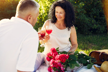 Beautiful adult couple spend time in a summer field
