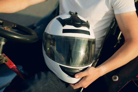 Handsome man in a karting with a carの写真素材