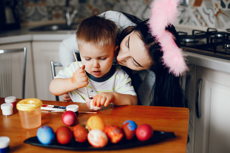 Mother with little son in a kitchen