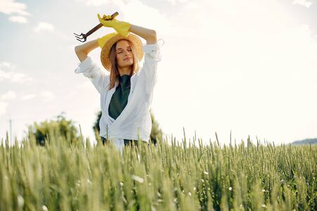 Beautiful woman in a summer fieldの写真素材