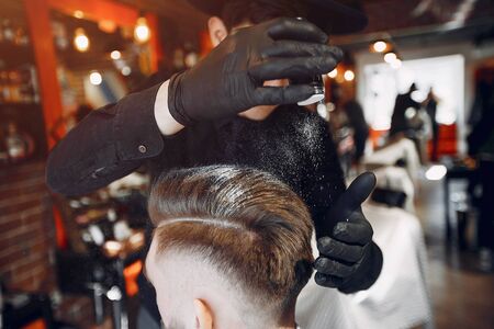 Man with a beard. Hairdresser with a client.の写真素材