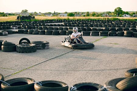 Karting. Man in a white t-shirt. Male with a kart carの写真素材