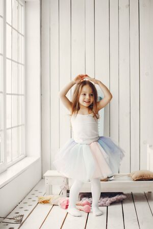 Cute little girl dancing at homeの写真素材