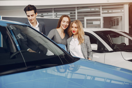 Two stylish woman in a car salon