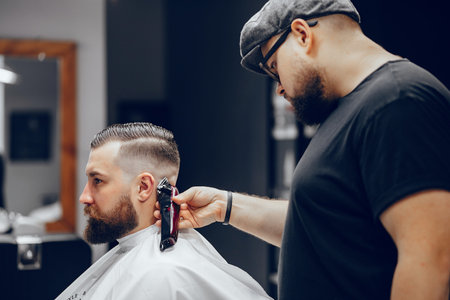 Stylish man sitting in a barbershop
