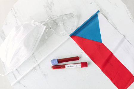Coronavirus testing sample and Czech flag are on the tableの写真素材