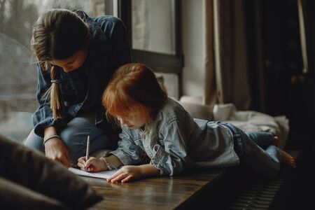 Two sisters at homeの写真素材