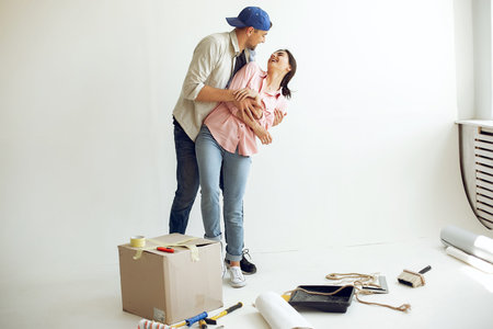 The young and cute family repairs the room