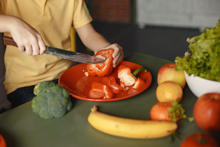 Children prepare salan in a kitchen