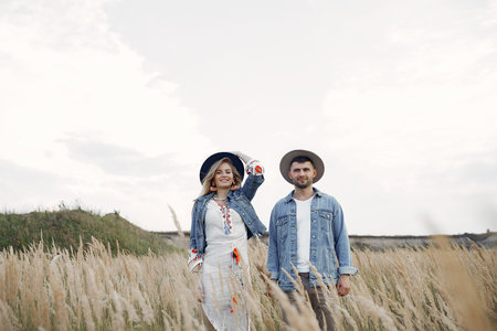 Very beautiful couple in a wheat field