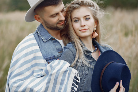 Very beautiful couple in a wheat field
