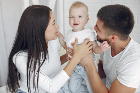 Beautiful family spend time in a bathroom