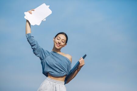 Cute girl have a rest on a sky backgroungの写真素材