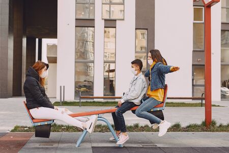 People in a mask standing on the streetの写真素材