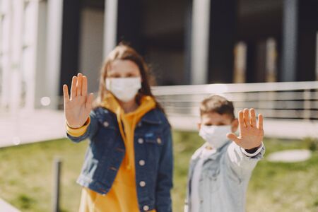 People in a mask standing on the streetの写真素材