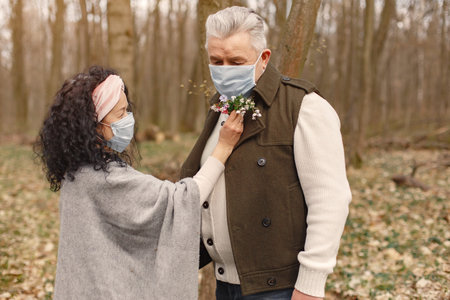 Elegant adult couple in a spring forest