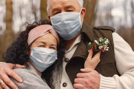 Elegant adult couple in a spring forest