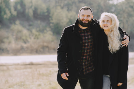 Beautiful couple spend time in a spring forest