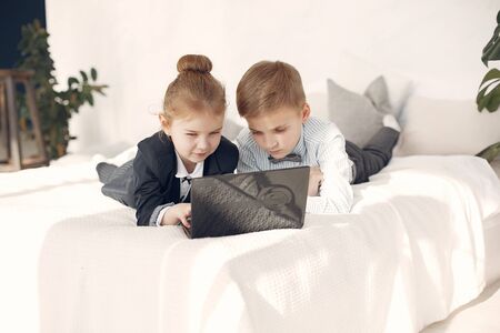 Children at the office with a laptopの写真素材