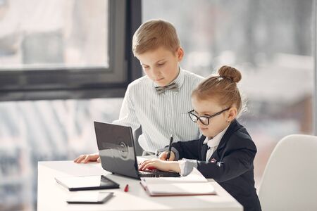 Children at the office with a laptopの写真素材