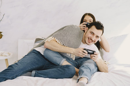 Couple at home playing in a video games