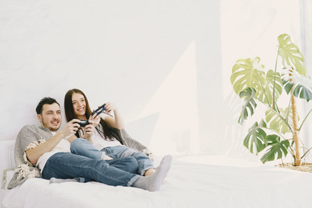Couple at home playing in a video games