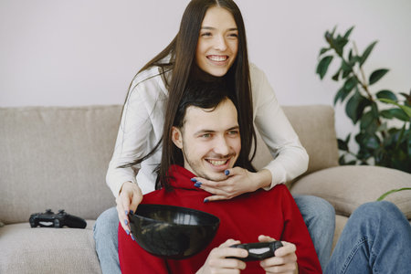 Couple at home playing in a video games