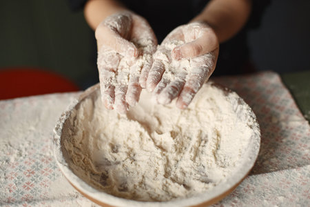 Little girl cook the dough for cookiesの写真素材